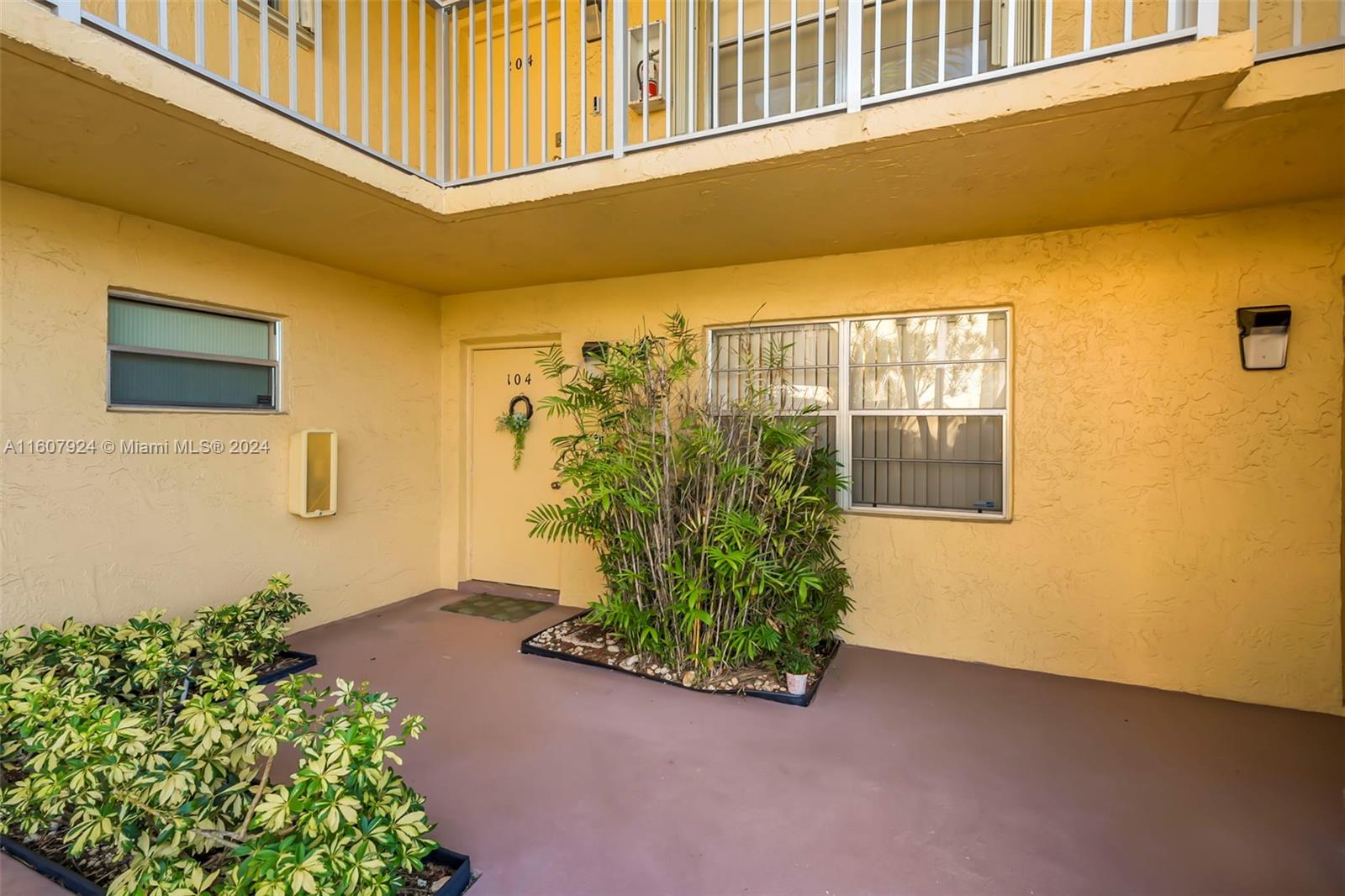 8780 Azalea Court, Unit 104 Tamarac, FL 33321 - Photo 4 of 37 a front view of a house