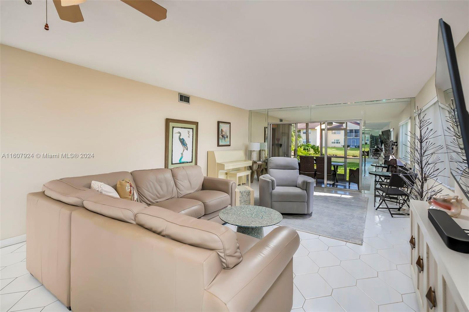 8780 Azalea Court, Unit 104 Tamarac, FL 33321 - Photo 8 of 37 a living room with furniture and a couch
