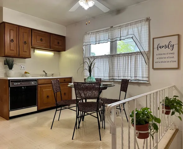 a dining room with furniture and window