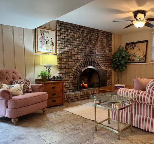 a room with furniture and flat screen tv