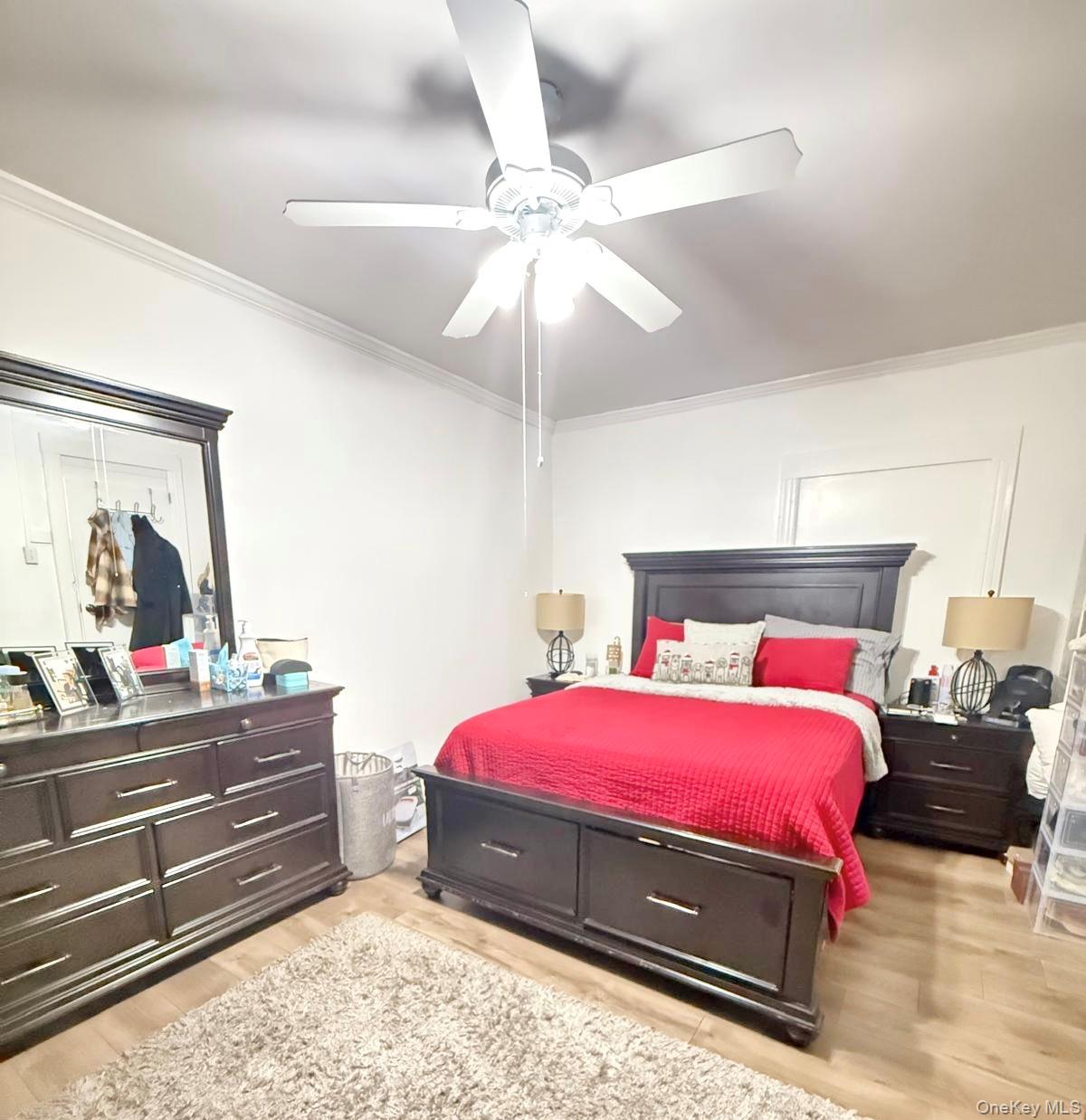 90-13 77th Street Queens, NY 11421 - Photo 11 of 16 a bedroom with a bed and a dresser