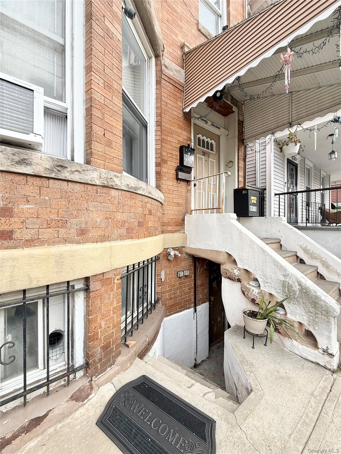 90-13 77th Street Queens, NY 11421 - Photo 2 of 16 a view of a patio with couches table and chairs and potted plants