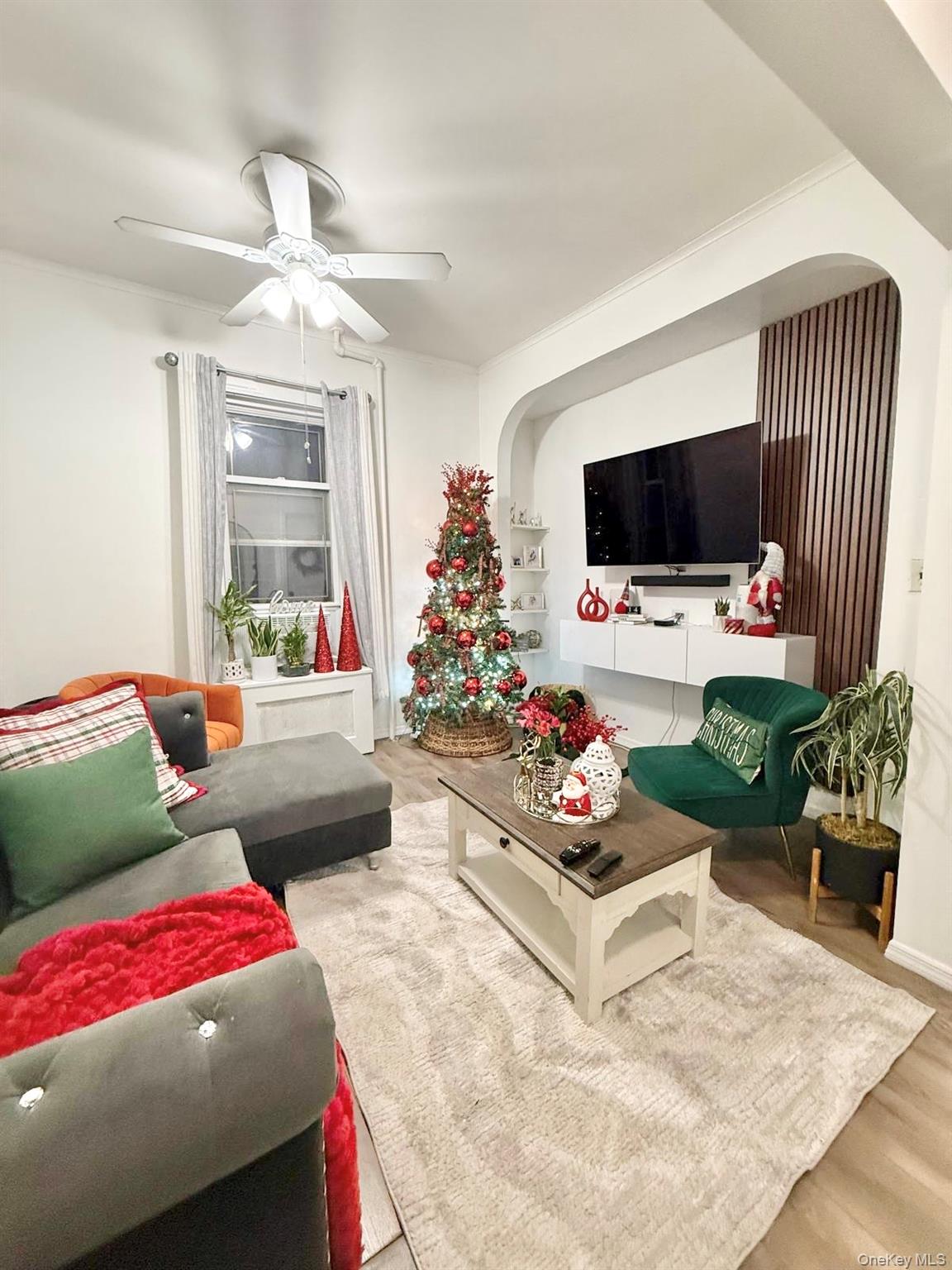 90-13 77th Street Queens, NY 11421 - Photo 5 of 16 a living room with furniture fireplace and flat screen tv