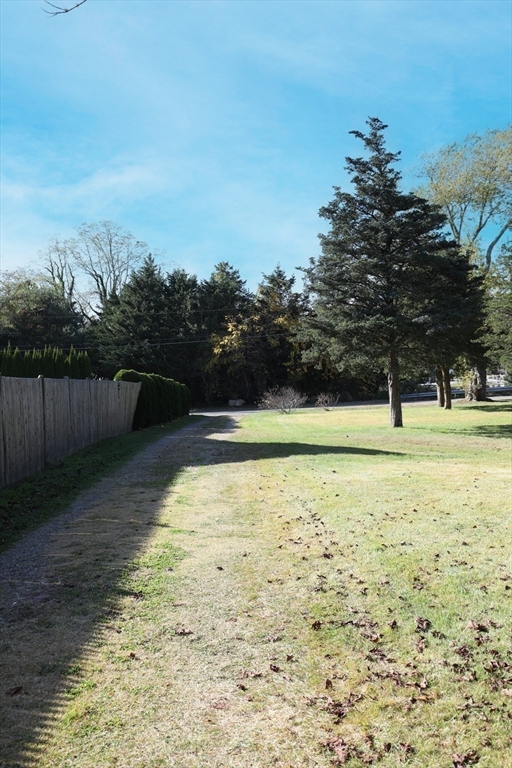 827 Shore Road Pocasset, MA 02559 - Photo 5 of 5 a view of a yard