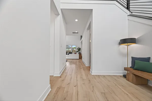 a view of a room with wooden floor