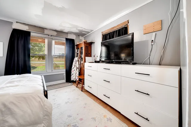 a bathroom with a tub and shower