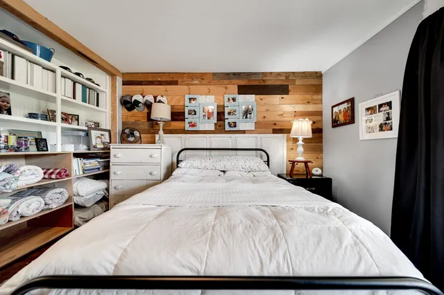 a living room with furniture fireplace and a window