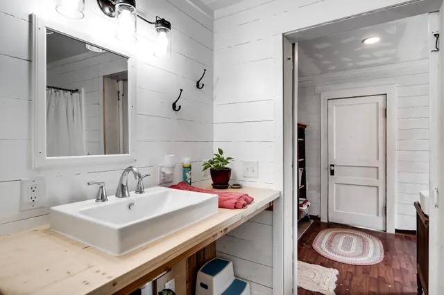a kitchen with a sink a stove and cabinets