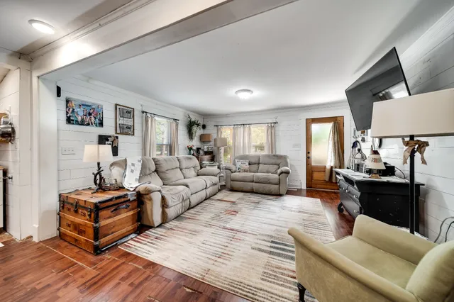 a kitchen with stainless steel appliances a refrigerator sink and microwave