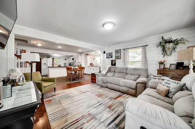 a kitchen with white cabinets and appliances