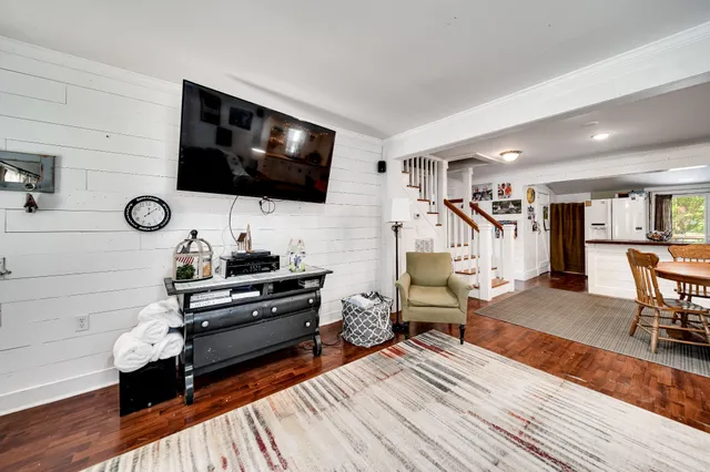 a view of center island cabinets and living room view