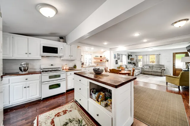 a big yard with trees in the background