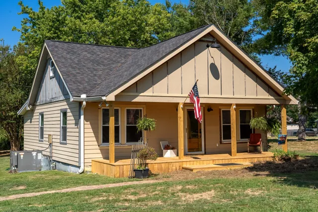 a view of a house with a tree bath