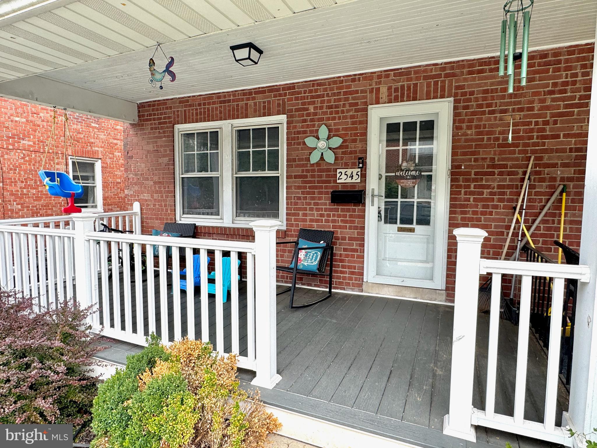 2545 Grant Street Reading, PA 19606 - Photo 2 of 25 a front view of a house with a porch