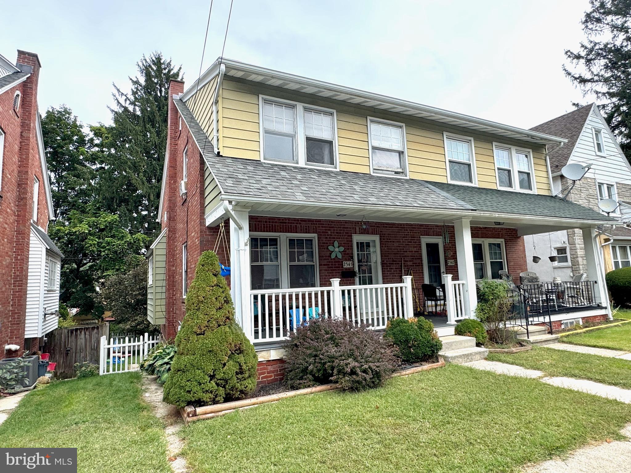 2545 Grant Street Reading, PA 19606 - Photo 22 of 25 a front view of a house with garden