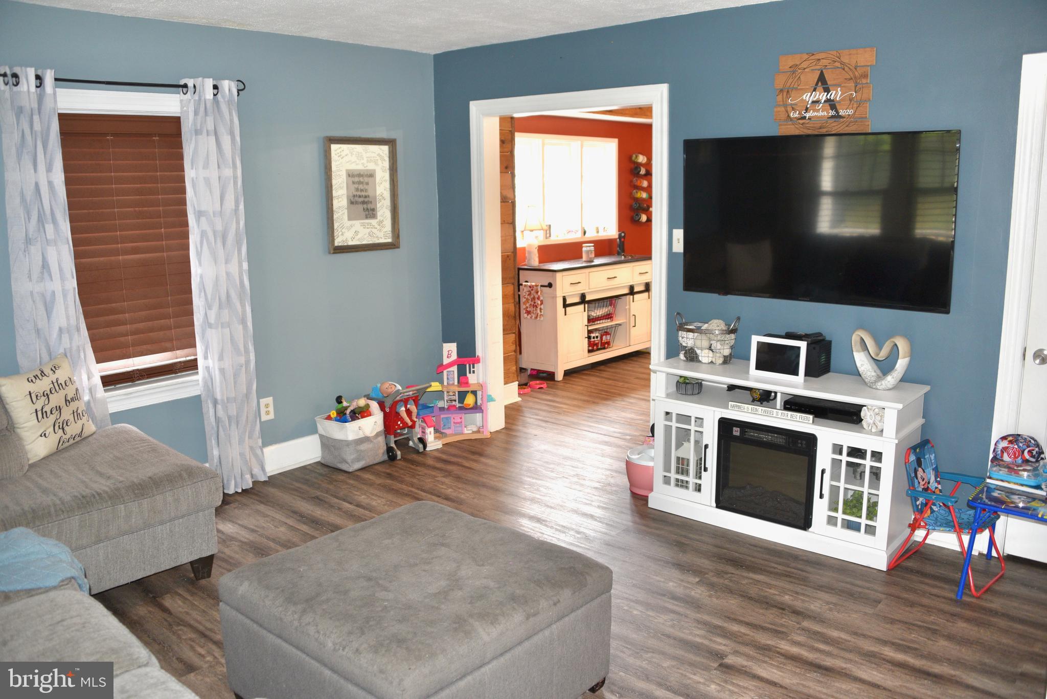 2545 Grant Street Reading, PA 19606 - Photo 5 of 25 a living room with furniture and a flat screen tv