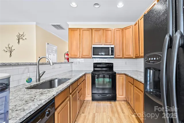 a view of a dining room with furniture and a chandelier