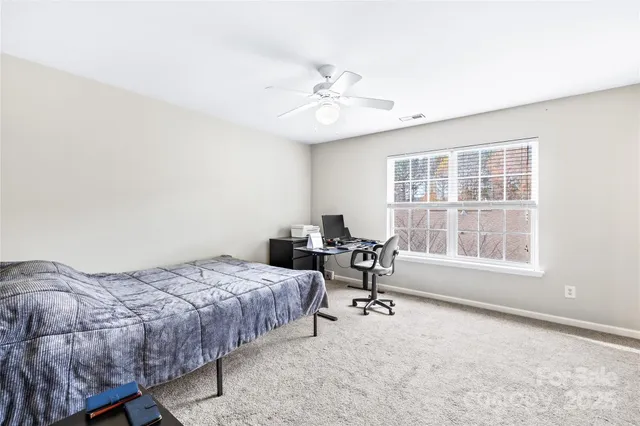 a bedroom with a workspace