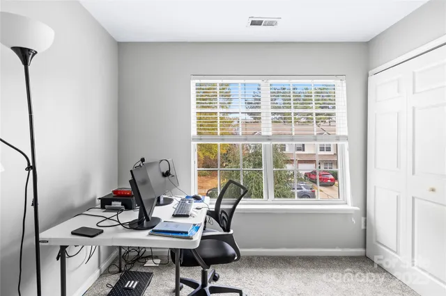 a view of balcony with wooden floor and outdoor seating