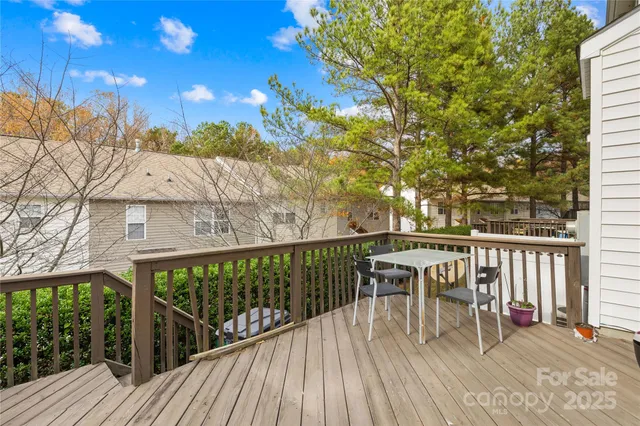 a view of a backyard with a chair and table