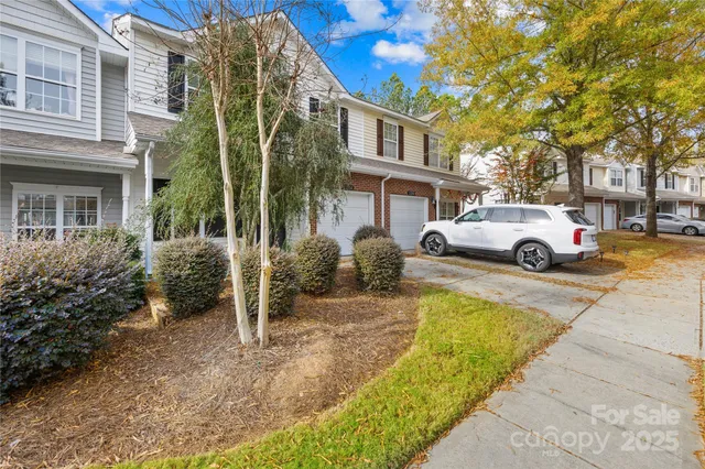 a car parked in front of a brick house