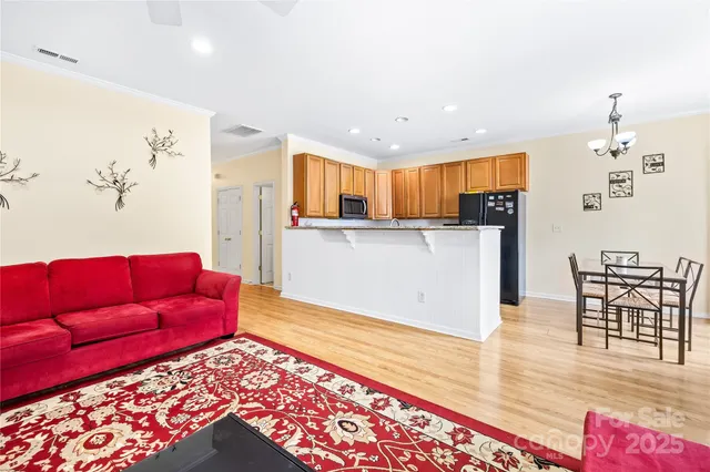 a living room with furniture fireplace and flat screen tv