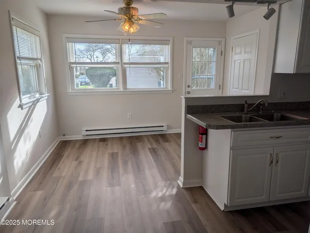 a kitchen with a sink and wooden cabinets