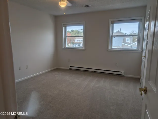 a bathroom with a granite countertop toilet a sink and bathtub