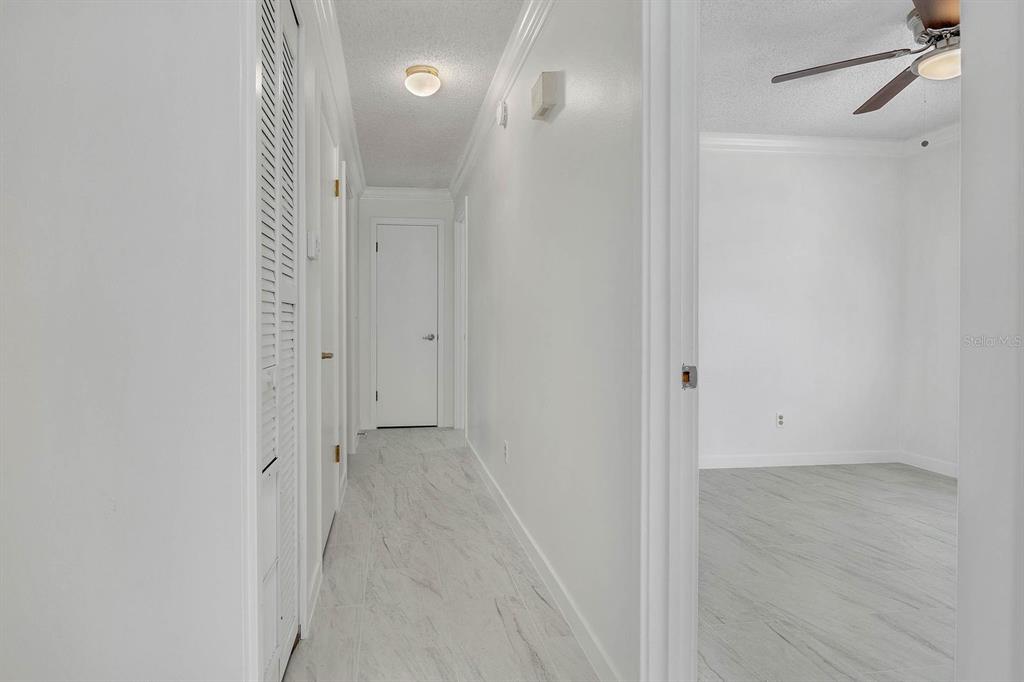 6449 Eve Street St. Cloud, FL 34771 - Photo 12 of 25 a view of a bathroom from a hallway