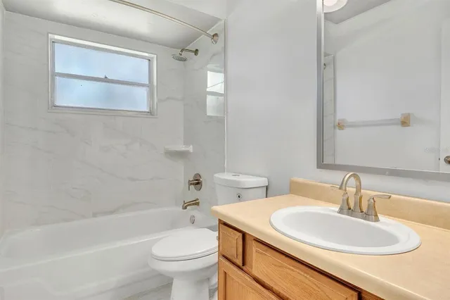 a bathroom with a sink toilet and a bathtub
