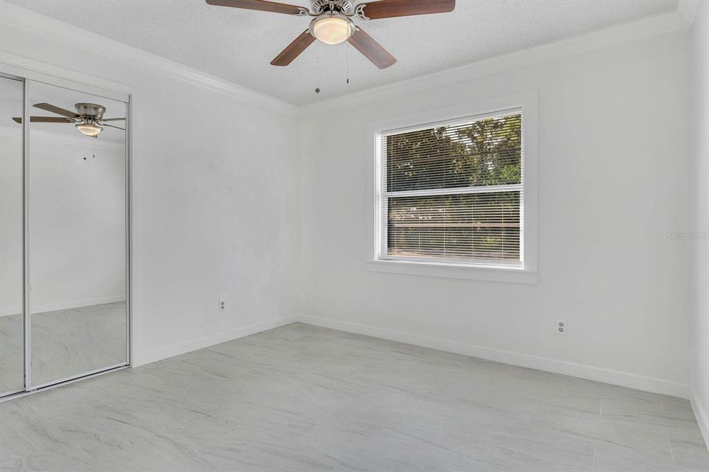 6449 Eve Street St. Cloud, FL 34771 - Photo 15 of 25 an empty room with a window