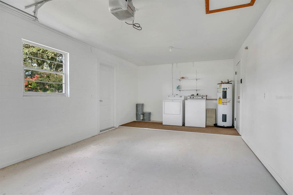 6449 Eve Street St. Cloud, FL 34771 - Photo 19 of 25 a view of a kitchen with furniture and white walls
