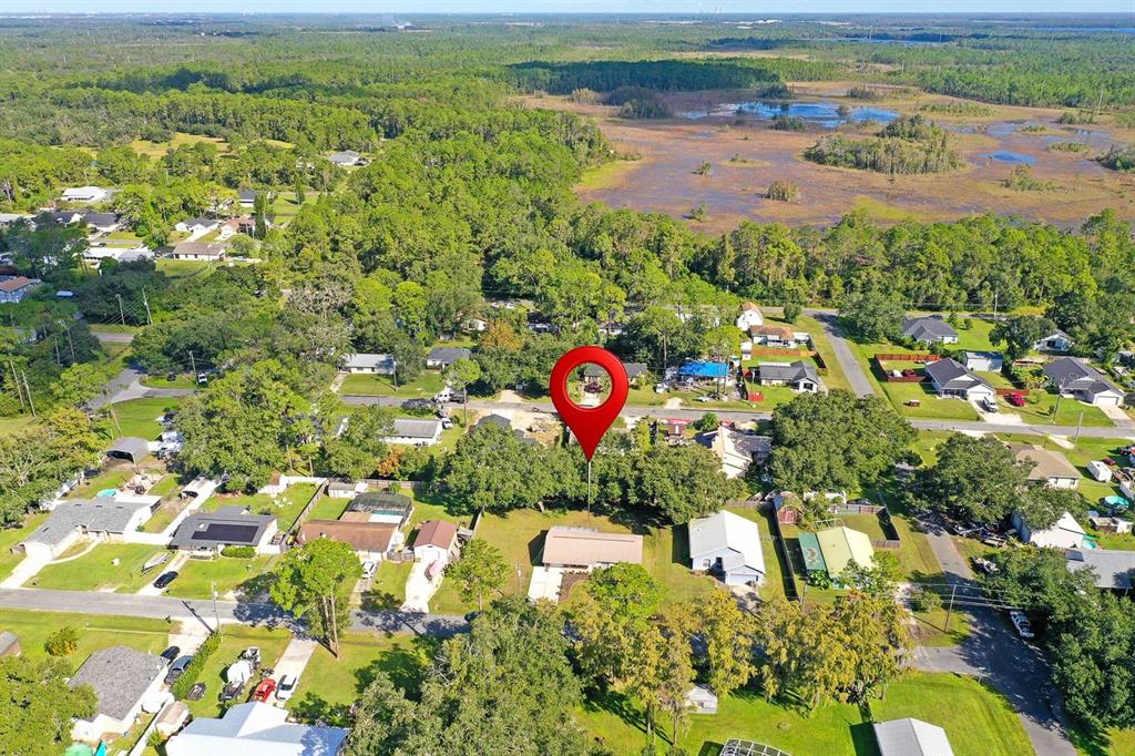 6449 Eve Street St. Cloud, FL 34771 - Photo 25 of 25 an aerial view of residential houses with outdoor space and trees