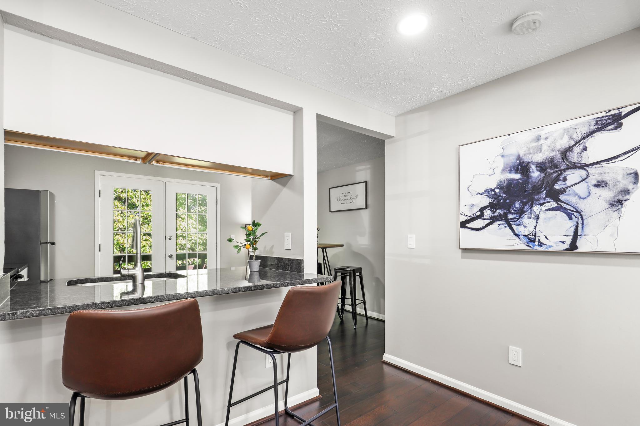 1937 Belmont Ridge Court Reston, VA 20191 - Photo 4 of 23 a living room with furniture and a large window