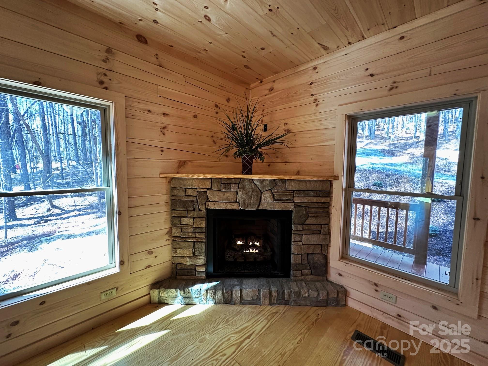 132 Chasewood Drive Rutherfordton, NC 28139 - Photo 17 of 40 a living room with a fireplace wooden floor and a fireplace