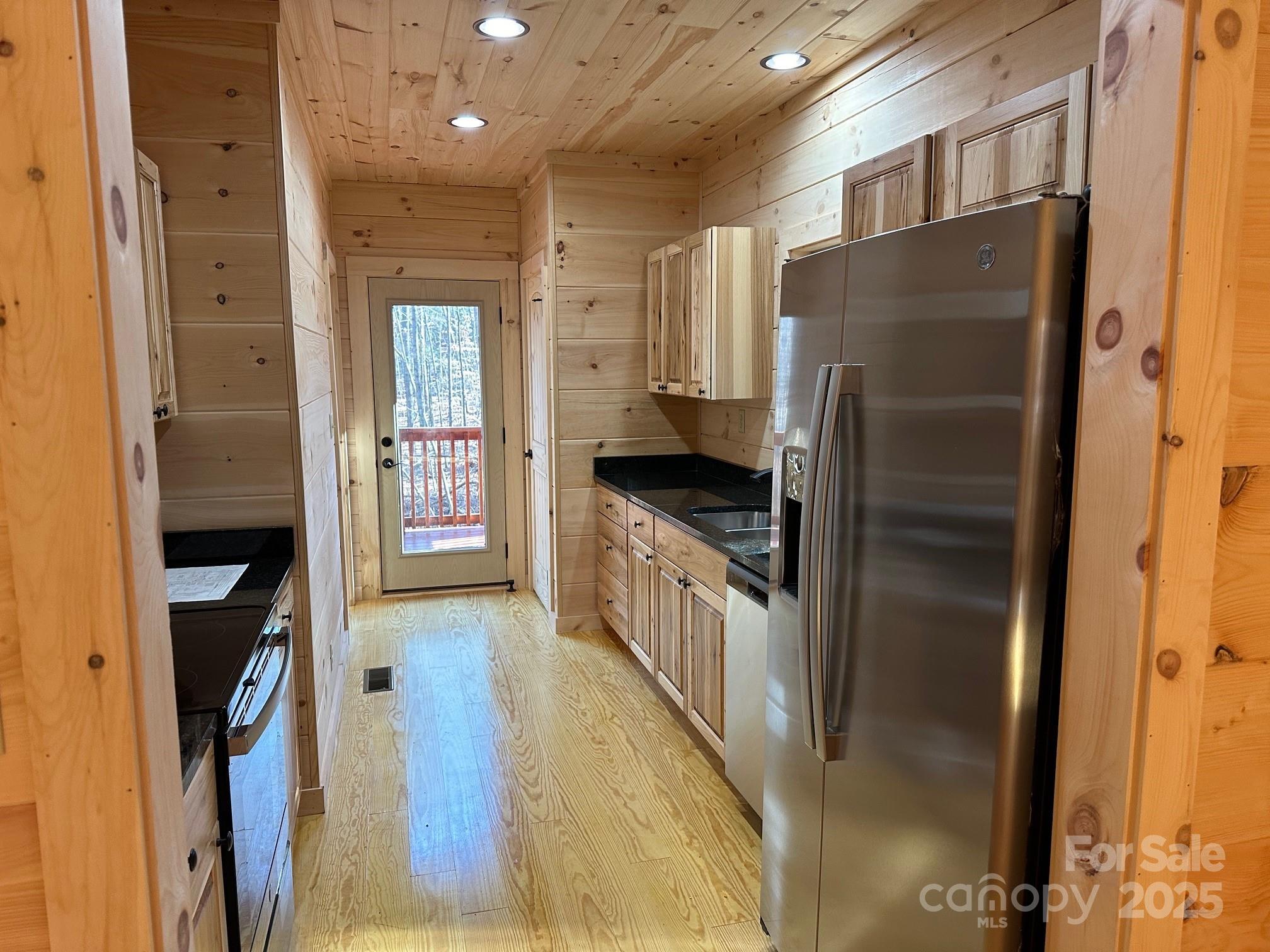 132 Chasewood Drive Rutherfordton, NC 28139 - Photo 21 of 40 a kitchen with stainless steel appliances granite countertop a refrigerator and a stove