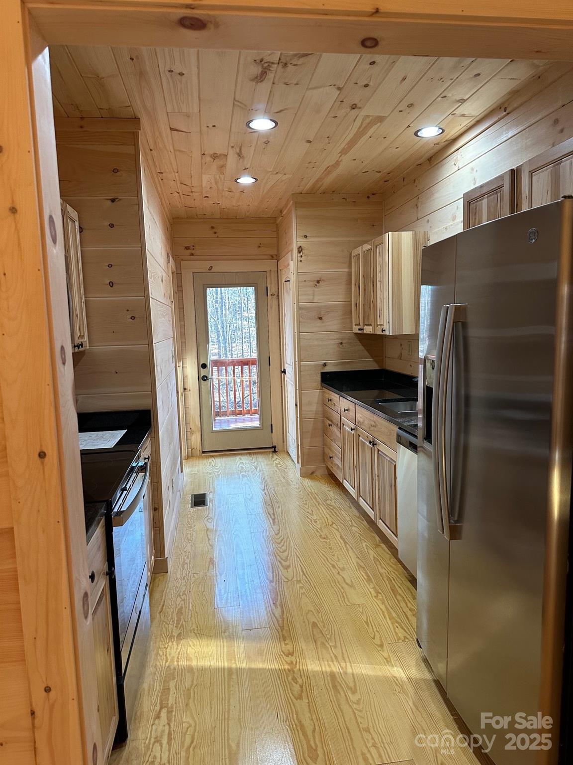 132 Chasewood Drive Rutherfordton, NC 28139 - Photo 22 of 40 a kitchen with a refrigerator and a sink
