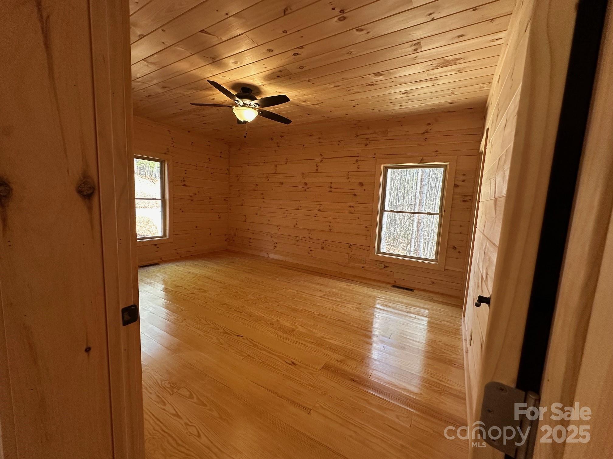 132 Chasewood Drive Rutherfordton, NC 28139 - Photo 26 of 40 a view of empty room with wooden floor and fan