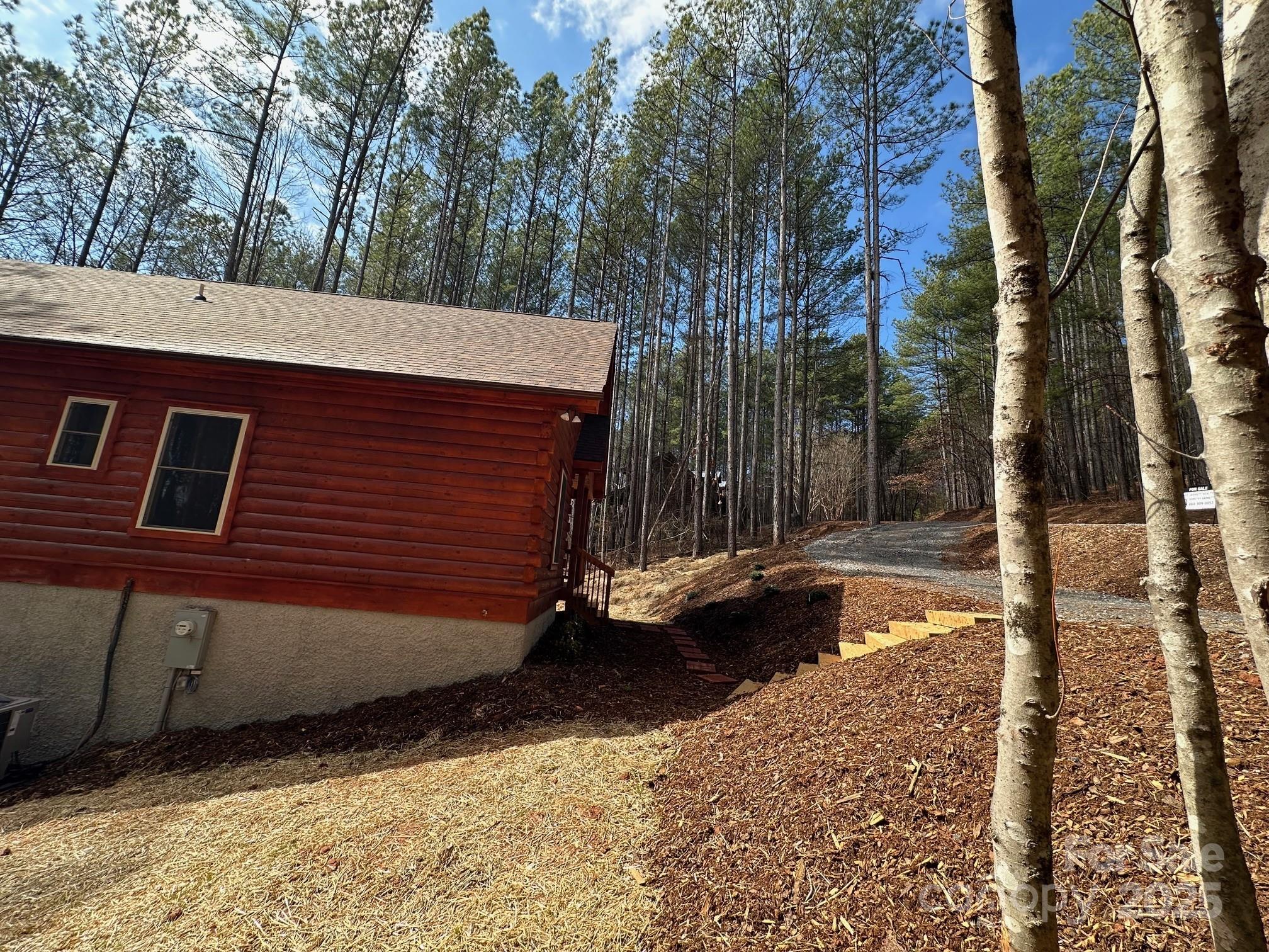 132 Chasewood Drive Rutherfordton, NC 28139 - Photo 7 of 40 a view of a backyard of the house