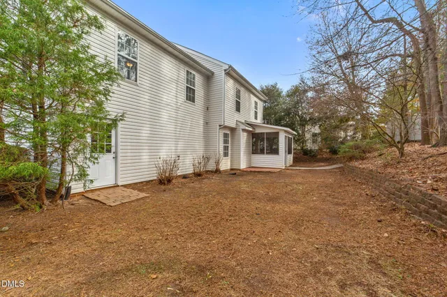 a view of a house with a backyard