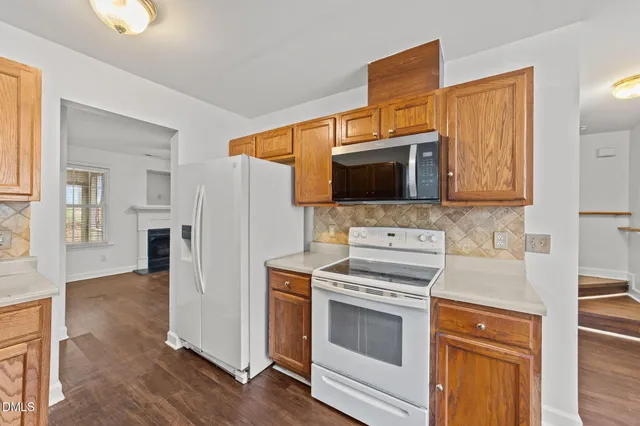 a kitchen with a stove and a microwave