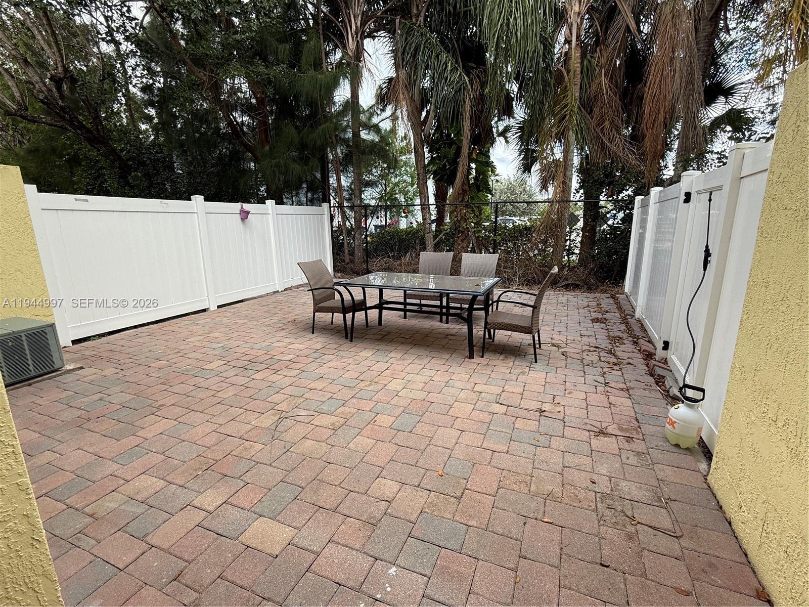 973 Imperial Lake Road, Unit 973 West Palm Beach, FL 33413 - Photo 16 of 28 a view of outdoor space with seating area
