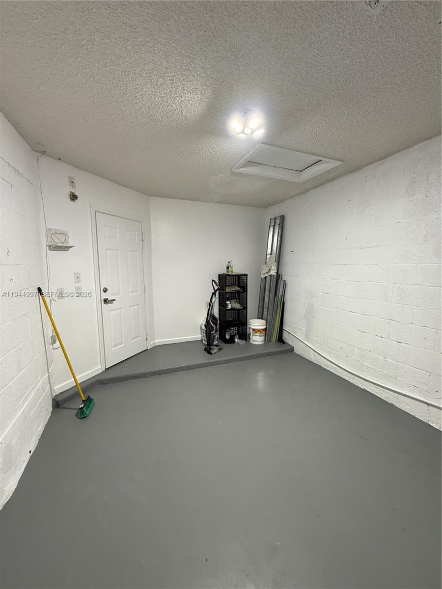 973 Imperial Lake Road, Unit 973 West Palm Beach, FL 33413 - Photo 2 of 28 a view of room with gym equipment