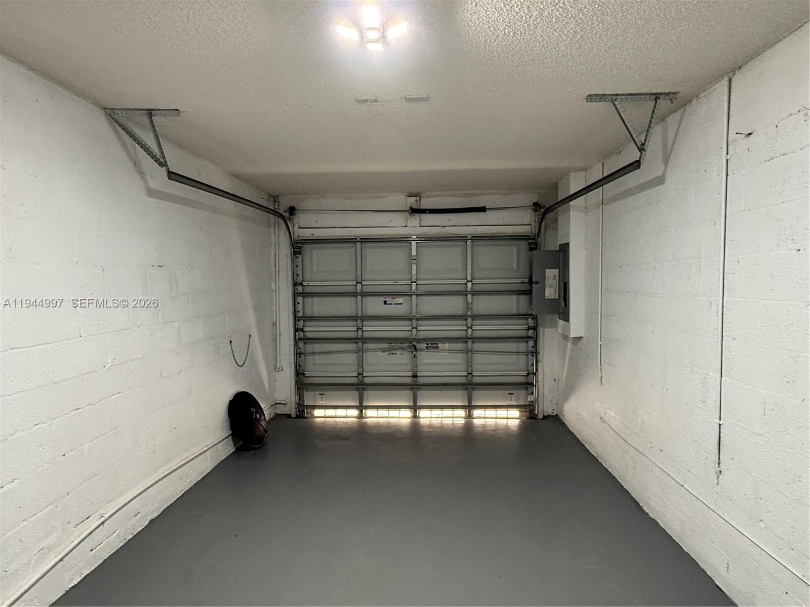 973 Imperial Lake Road, Unit 973 West Palm Beach, FL 33413 - Photo 26 of 28 a view of empty room with windows