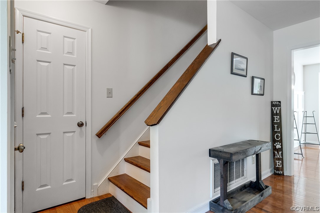 13601 Danwoods Road Midlothian, VA 23113 - Photo 8 of 33 a view of an entryway with wooden floor and staircase