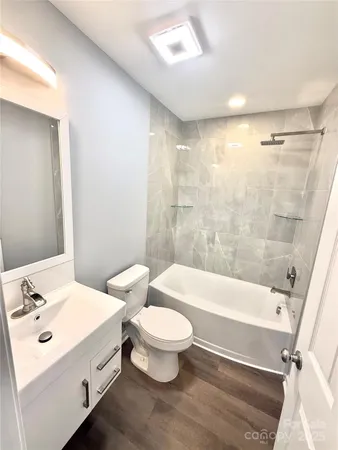 a bathroom with a sink a toilet and a bathtub