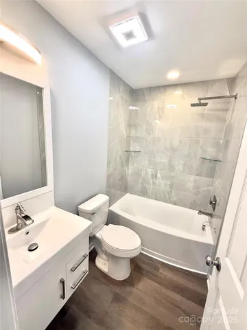 a bathroom with a sink a toilet and a bathtub