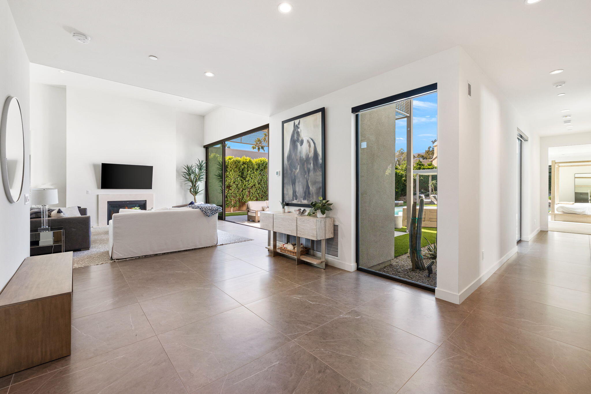 57809 Santo Thomas La Quinta, CA 92253 - Photo 19 of 51 a living room with furniture and large windows