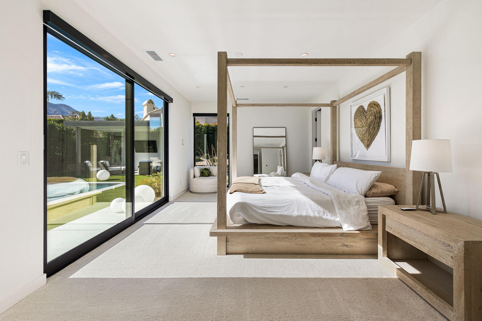57809 Santo Thomas La Quinta, CA 92253 - Photo 21 of 51 a bedroom with a large bed and a large window
