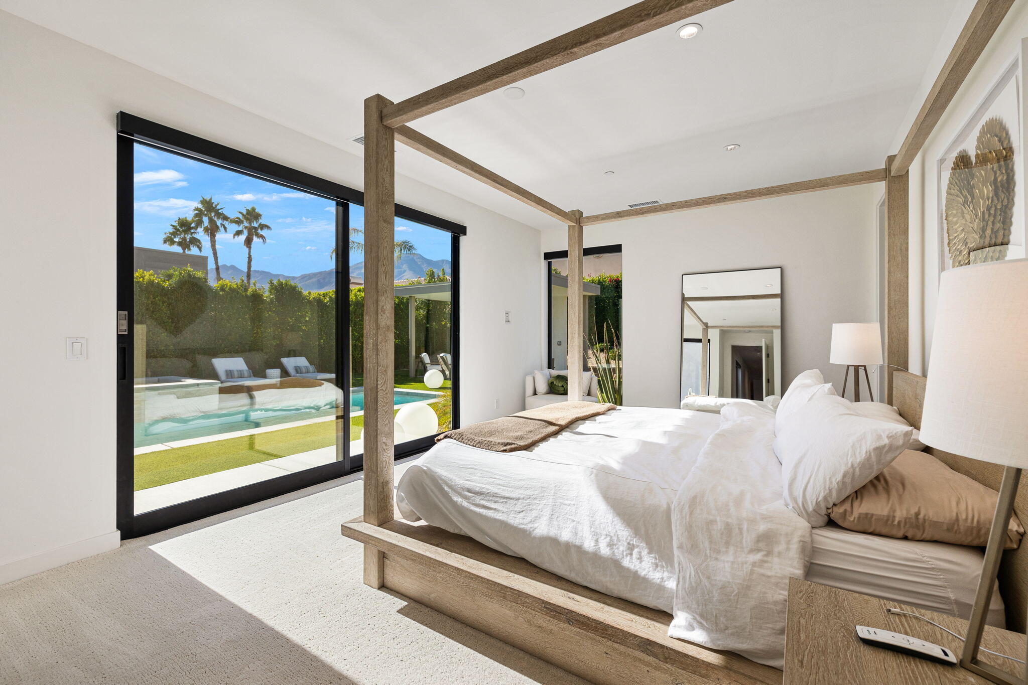 57809 Santo Thomas La Quinta, CA 92253 - Photo 22 of 51 a bedroom with a large bed and a large window